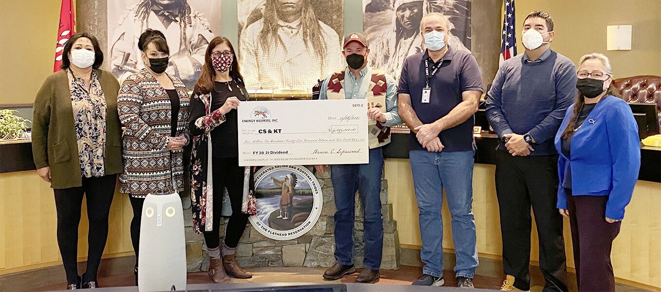 EKI CEO Brian Lipscomb ceremoniously presents the FY 20 21 dividend check to Tribal Council